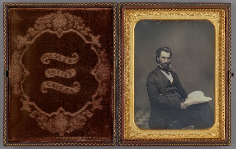 [Portrait of a Seated man with hat on knee]