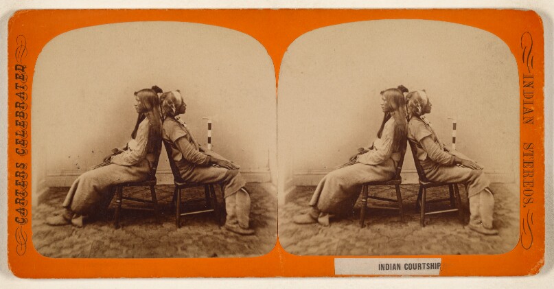 [A Native American Man and Woman Seated Back to Back]
