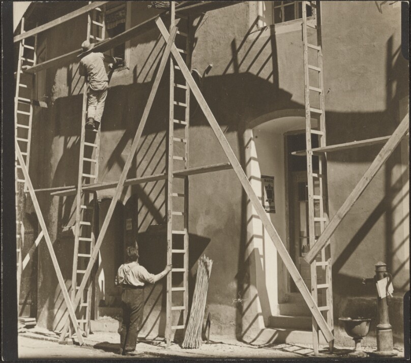 [Men at construction site]