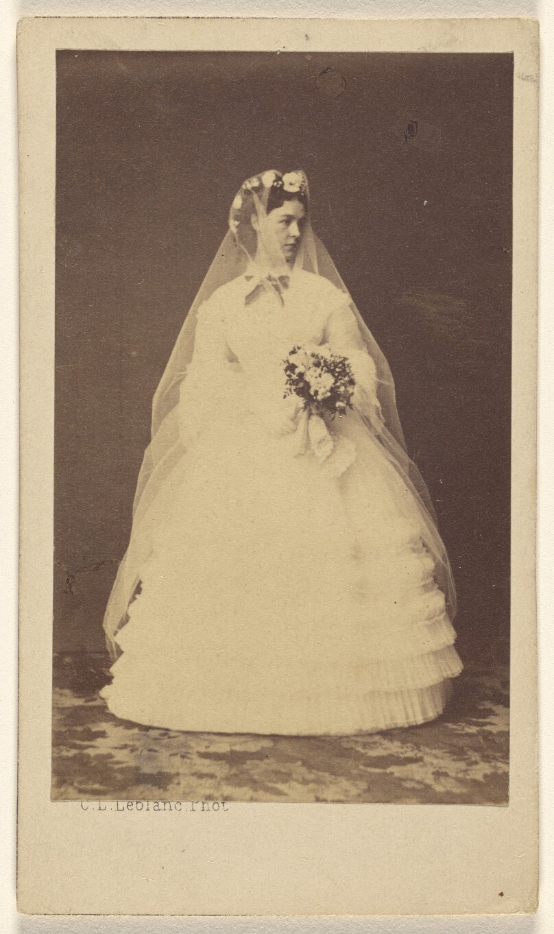 [Woman in wedding dress, standing]