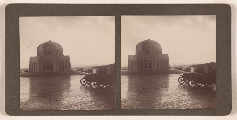 [Domed-shaped building with Model-T cars in parking lot]