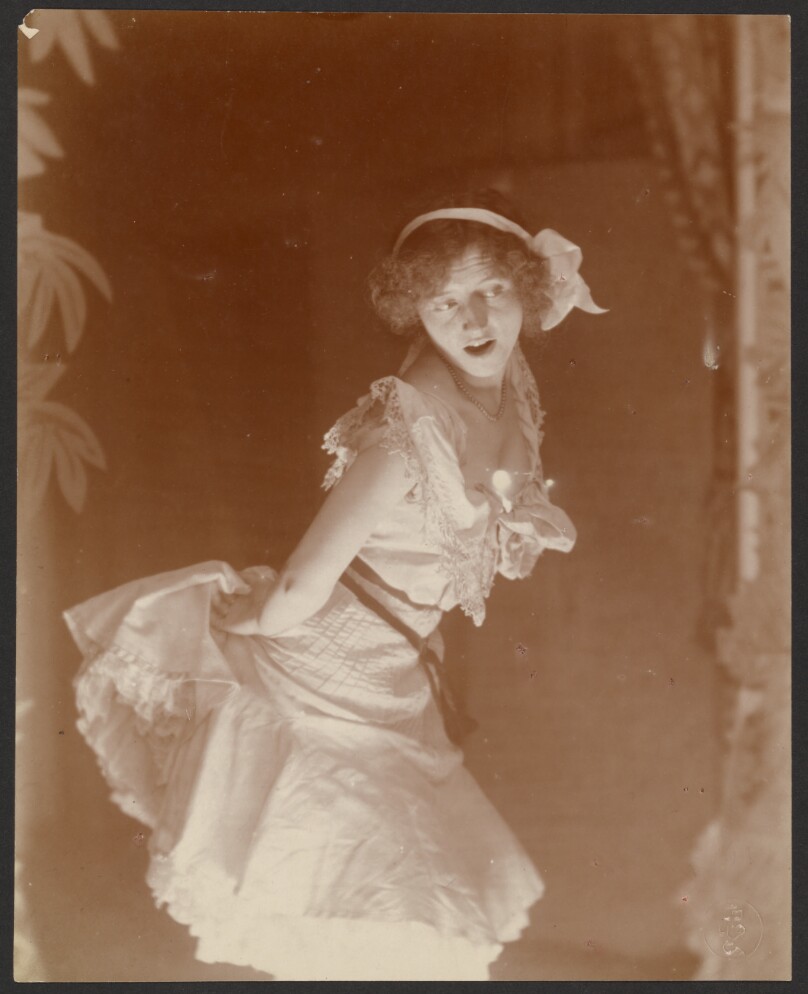[Woman in white dress]