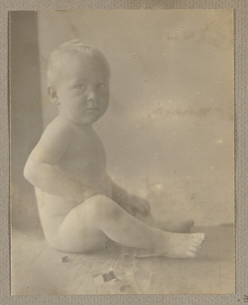 [Neil Weston nude, seated on wood shelf]