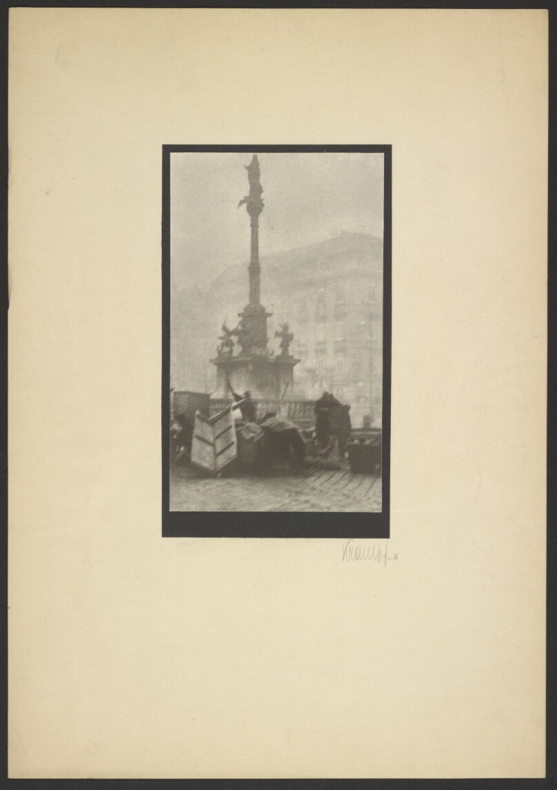 [People gathered around monument]