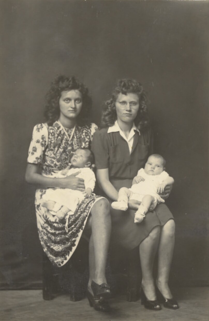Untitled (two women, seated, each holding baby)
