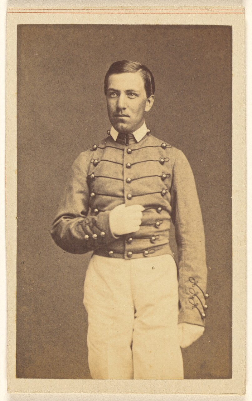 [Unidentified Civil War soldier standing, holding the center of his coat]