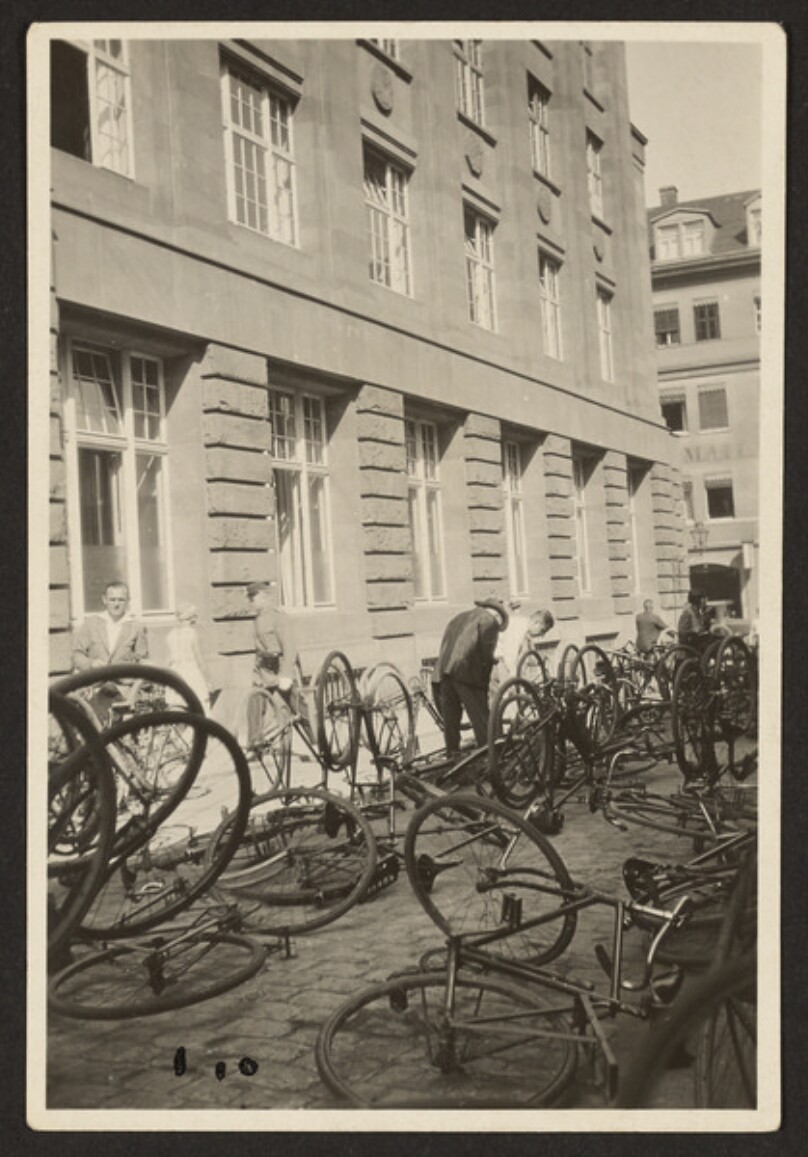 [Bicycles Parked on Cobblestone Street]