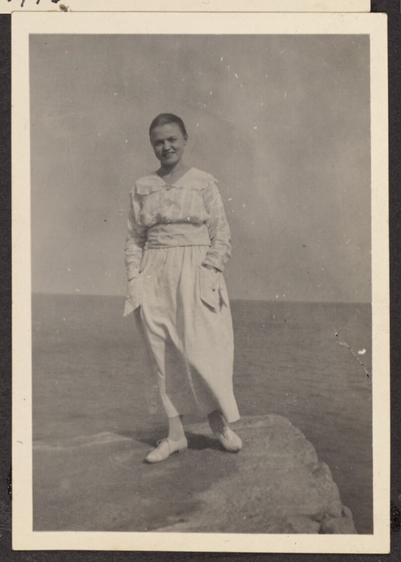 [Woman in a white dress]