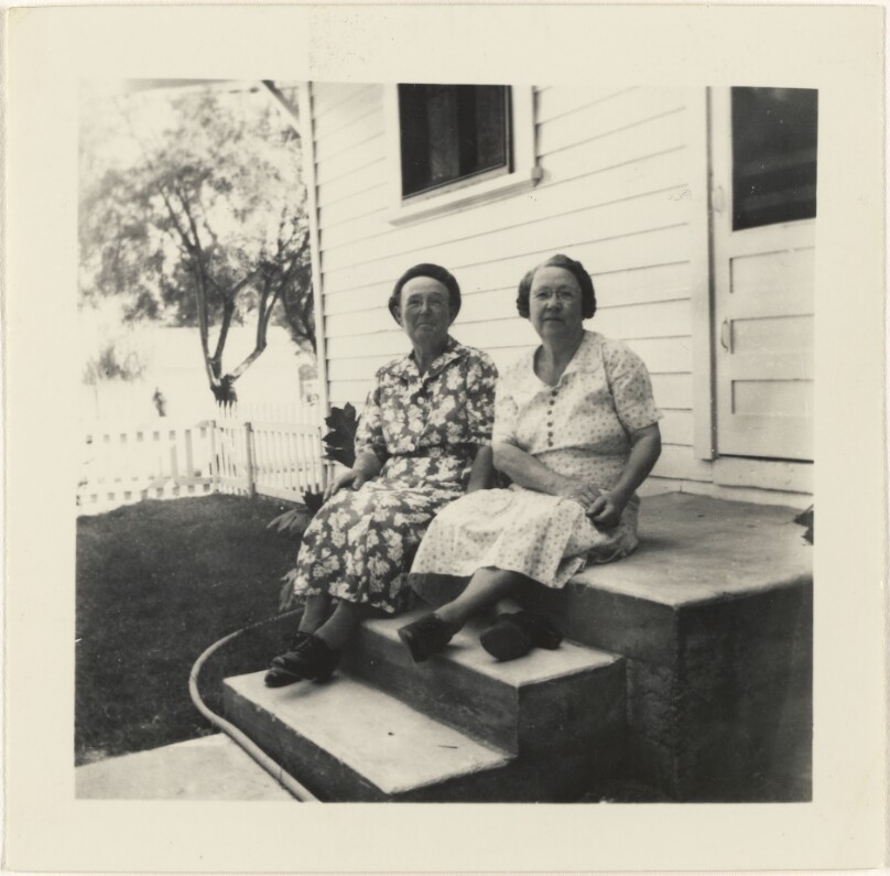 [Two women on steps]