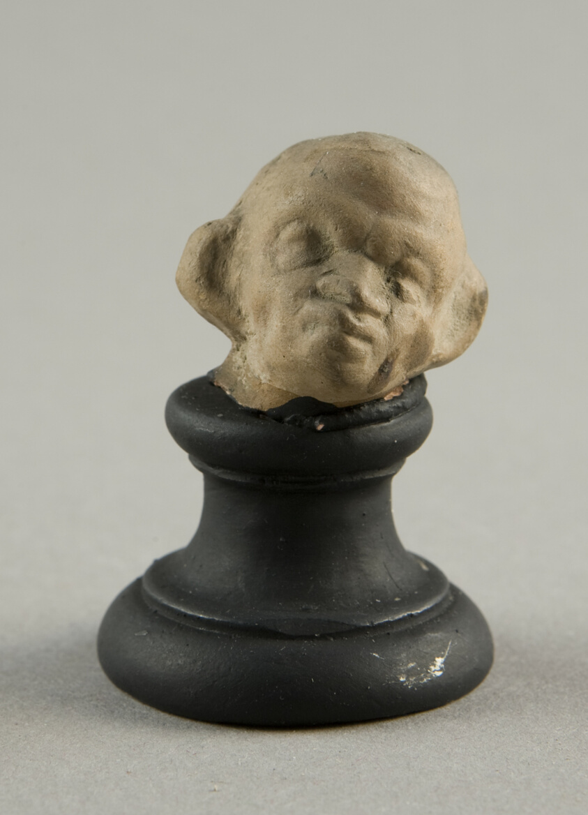 Head of a Grotesque Wearing Wreath