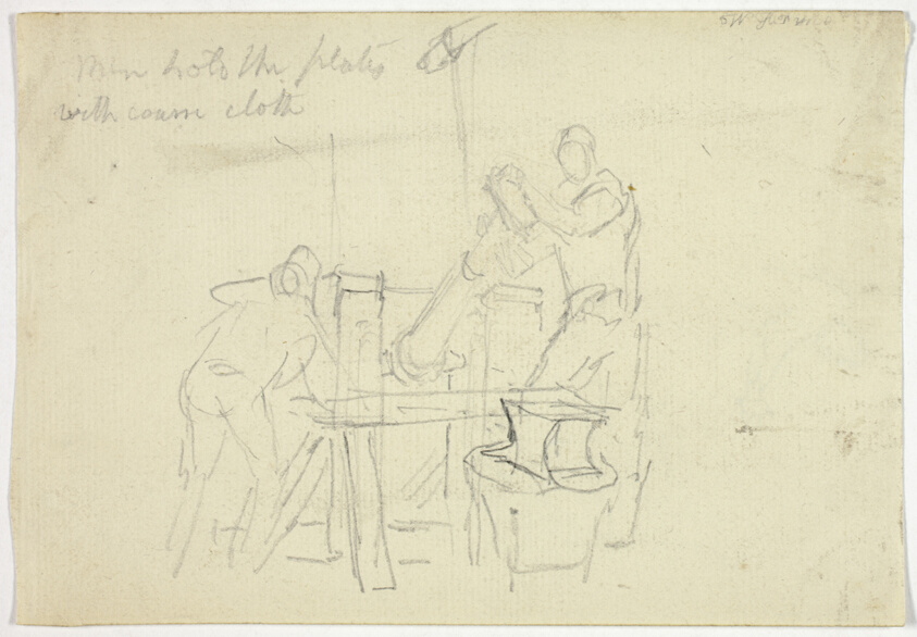 Two Men Working at a Machine