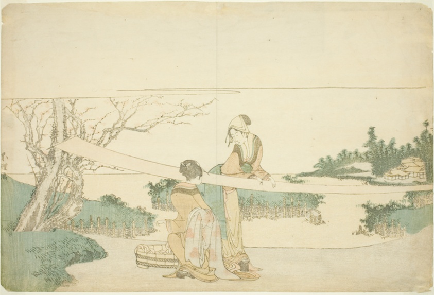 Two women stretching cloth