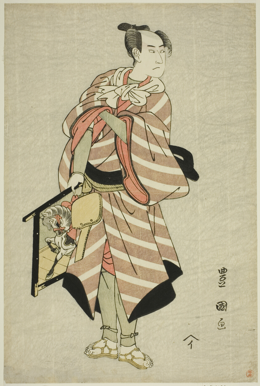 The actor Sawamura Sojuro III as the packhorse-man Muchizo in the play "Miyamairi Musubi no Kamigaki," performed at the Kiri Theater in the eleventh month, 1797