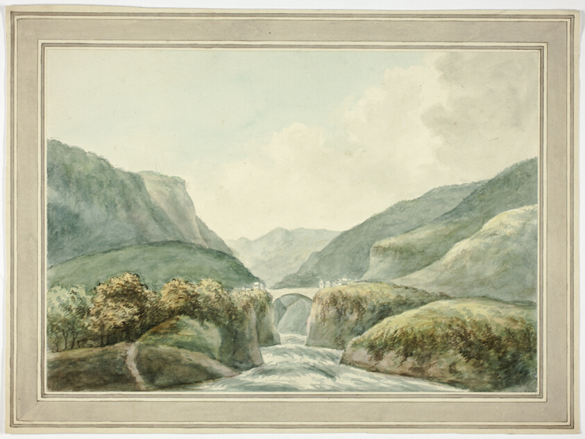 Mountain Town by Bridge Spanning Rapids