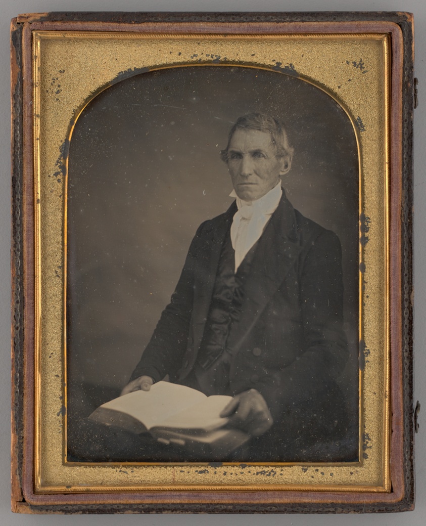 Untitled (Portrait of a Seated Man Holding a Book)