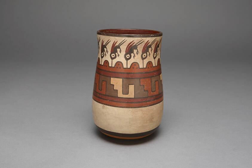 Beaker Depicting Abstract Hummingbirds or Insects