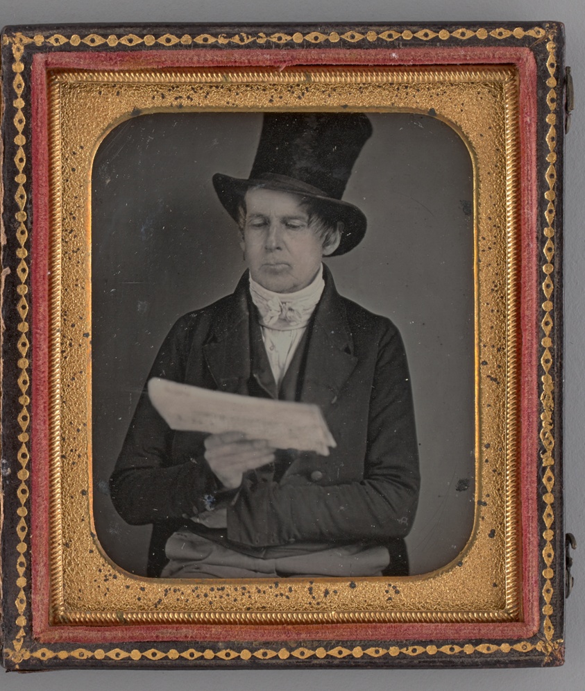 Untitled (Portrait of a Man Reading a Newspaper and Wearing a Top Hat)