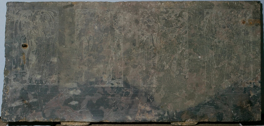 Stone panel carved in low relief with narrative scenes