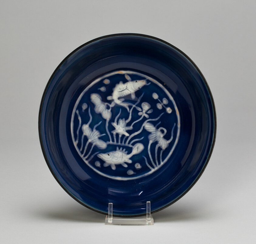 Dish with Fish Swimming in Lotus Pond