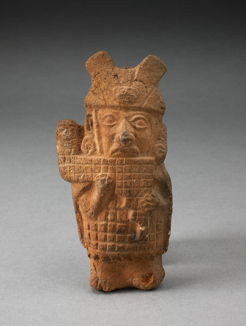 Whistle in the Form of a Figure Playing Pipes