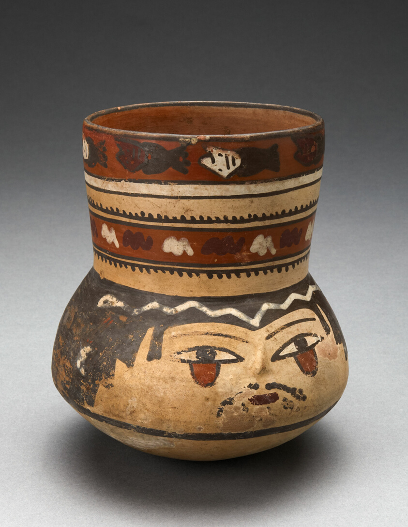 Beaker Depicting Human Head and Rows of Geometric Motifs